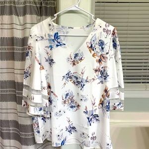 White, floral blouse.